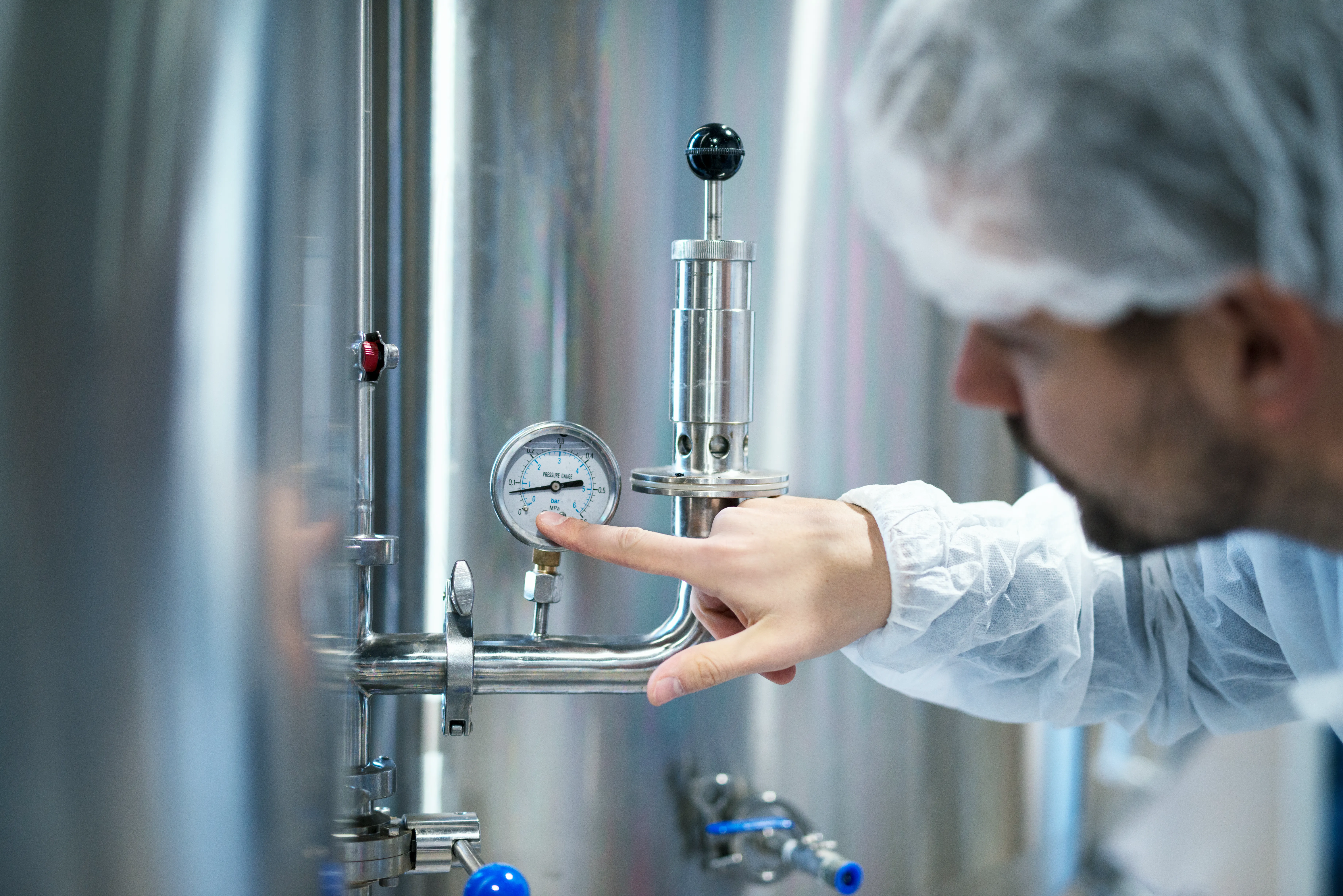 Engineer inspecting lifting equipment and pressure systems